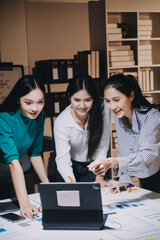 Canvas Print - Group of young asian creative business brain storm meeting presentation,discussing roadmap to product launch, planning,strategy,new business development,working with new startup project in office.