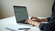© Denis - Professional email setup with a person drafting an email on a sleek laptop at a clean desk
