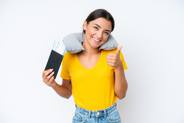 Poster - Woman with Inflatable Travel Pillow over isolated background giving a thumbs up gesture