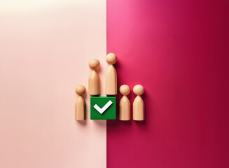 Aufkleber - Grainy texture image of wooden figurines arranged around a green square with a checkmark.  The scene is split by a contrasting pink and burgundy background.
