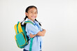 © sorapop - Portrait smiling Asian little girl kindergarten with schoolbag crossed arms studio shot isolated white background, good job feedback, happy woman kid in pigtails wearing school uniform, back to school
