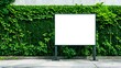 © RulArt - White billboard on spring summer green leaves