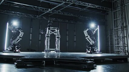Fototapete - Robotic arms demonstrate precision movement and teamwork in a controlled environment