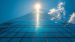 © Wanida - Modern Glass Skyscraper Reaching Toward a Bright Sun
