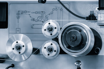 Poster - Complex Industrial Machine with wheels rollers with metal wire. The machine is made of metal and has many parts