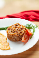 Wall Mural - Hearty buckwheat dish with tomato and creamy sauce. A simple yet delicious meal, perfect for a healthy and satisfying lunch or dinner.