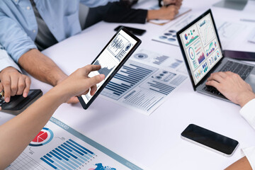Fototapete - Analyst team uses BI Fintech display tablet to analyze financial data . Business people analyze BI software technology dashboard power for insights power into business marketing planning. Prudent