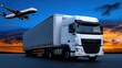 © KN Studio - Global Logistics: A modern semi-trailer truck stands ready for transport against a vibrant sunset, with an airplane descending in the background.