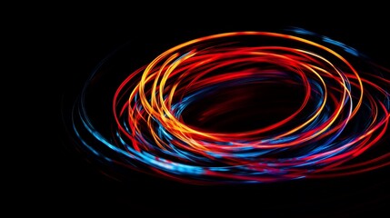 Wall Mural - Dynamic light trails with red yellow and blue hues circling on a black background