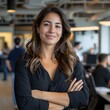 © SECOND - Confident woman office portrait, arms crossed, blurred background, team
