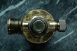 © stockphoto02 - Close-up view of a vintage brass valve with intricate details and aged patina.