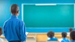 © admin_design - Young boy focused and engaged in learning at his desk in a classroom environment