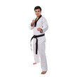 © suphaporn - Male Taekwondo athlete in a traditional white dobok with a black belt, demonstrating a fighting stance against isolated on a transparent background