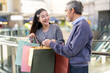 © Art_Photo - Father and daughter happy excited shopping together checking items in shopping bags, family joy, retail, sale, store experience, discounts, weekend shopping relationship unpacking gifts at mall