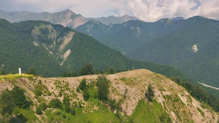 Wall Mural - Drone view of lush green mountains with forest and unpaved roads on hill in Gebele, Azerbaijan