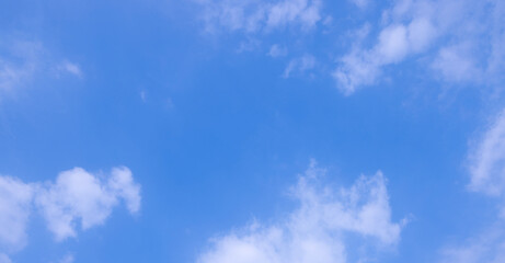 Wall Mural - clean air daytime bright blue sky and clouds.view of blue sky with shining sun. white fluffy clouds 