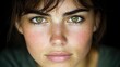 © BROPRADANA - Close-up portrait woman, intense gaze, freckles, natural beauty, skincare ad