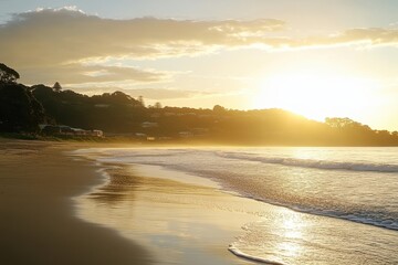 Wall Mural - Golden sunrise over a tranquil beach. Perfect for travel, vacation, and relaxation themes.