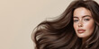 © Vasiliy - Woman with brown wavy hair on beige background. Beauty and hair care marketing