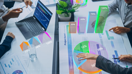 Aufkleber - Top-down View of Business Meeting With Interactive Data Projections. Holographic Charts, Graphs, and Percentages Overlay Physical Documents, Showcasing Innovative Analysis and Collaboration 