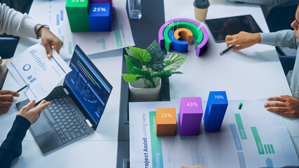 Leinwandbilder - Top View of a Business Meeting With Interactive Holographic Data Visualizations. Professionals Analyze Charts, Graphs, and Percentages Projected. AI Technology in Modern Corporate Revenue Growth