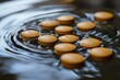 Brown tablets floating on water surface create ripples in peaceful setting
