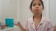 © FAMILY STOCK - Asian cute girl to rinse your mouth after brushing your teeth, health care concept