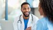 © Vilaysack - smiling doctor in white coat with stethoscope discusses treatment plans with patient in bright medical office, fostering positive and supportive atmosphere