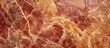 © Rufat - Rich reddish-brown marble texture with golden veins, featuring a polished finish and intricate natural patterns; perfect for luxury backgrounds.