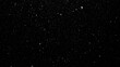 © rezasrz - Snowflakes descending against a dark backdrop