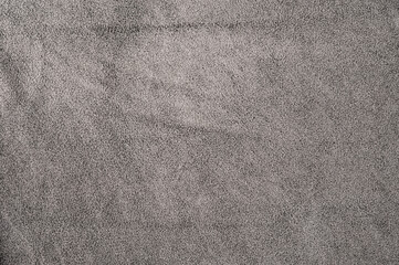 Wall Mural - natural gray suede leather as a macro photo background.