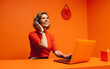 © Jacob Lund - Smiling mature woman with headset in monochromatic orange workspace, emphasizing creativity and modernity