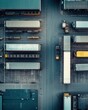 © peerawat - A drone view of a busy trucking hub with multiple loading docks