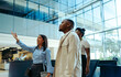 © Jacob Lund - Confident manager onboarding new recruits in a bright corporate office setting