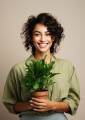 Wall Mural - Woman holding houseplant portrait smile adult.