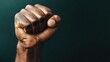 © senadlife - An artistic close-up of a clenched fist representing willpower and resilience, set against a muted dark background that adds depth and intrigue to the image.