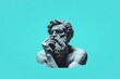© ElenaX - Sculpture of thoughtful philosopher blue background