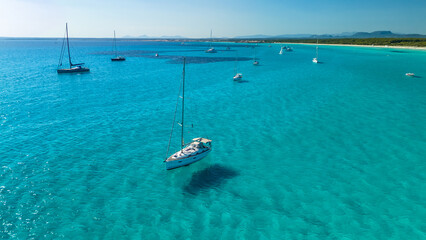 Wall Mural - Beautiful sailboat is moored in the incredible turquoise waters of Mallorca