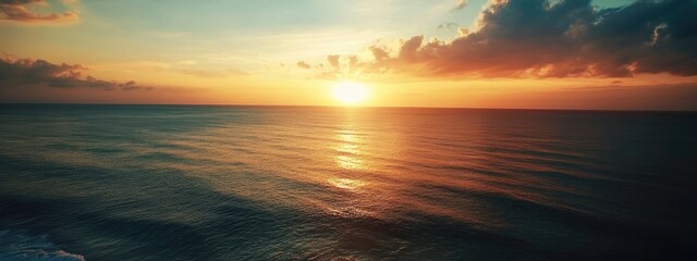 Aufkleber - Drone view of tranquil ocean at sunset with colorful clouds and expansive sky ideal for text overlay or inspirational quotes