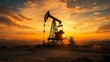 © Biggy - Silhouette of Oil Pump Jack Against Dramatic Sunset Sky