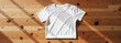 © Andrey - Round Neck T-Shirt Mockup on wooden table with natural lighting
