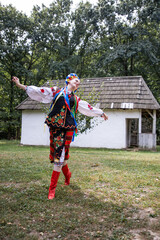 Woman in traditional costume dancing. Ukrainian woman. A young woman in a national Ukrainian costume. Embroidery. Ukrainian national clothing.