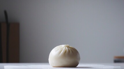 Wall Mural - of a single, perfectly steamed white baozi bun, glistening with condensation, set against a clean, minimalist background with ample copy space. Steamed Buns.Chinese Food 