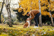 © Dusan Petkovic - Dog owner is cuddling and petting his best canine friend in city park.
