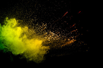 Wall Mural - colorful explosion of powdery dust is captured in a yellow and green cloud