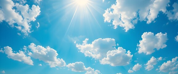 a wide shot of a partly cloudy sky. the sky is a vibrant, clear blue, with scattered, puffy white cl