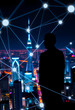 © Go - Digital network lines and nodes superimposed on a vibrant night cityscape, symbolizing connectivity, silhouette, with white tones