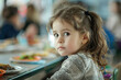 © Tetiana - Young Child boy girl Eating Lunch in a School Canteen Setting with Juice and Food on Table, Generative AI