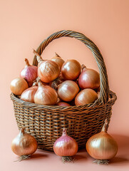 Wall Mural - Basket of onions against a peach background.