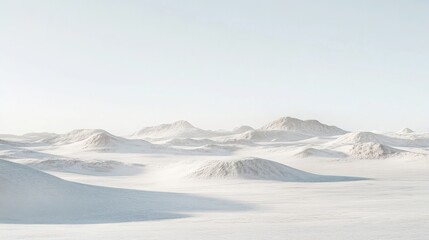 Serene winter landscape with gentle snow-covered hills under a clear sky, evoking tranquility